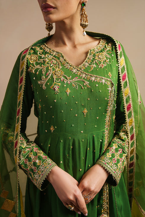 Close view of KEZIA green angrakha neckline showing adda work embroidery and sequin detailing