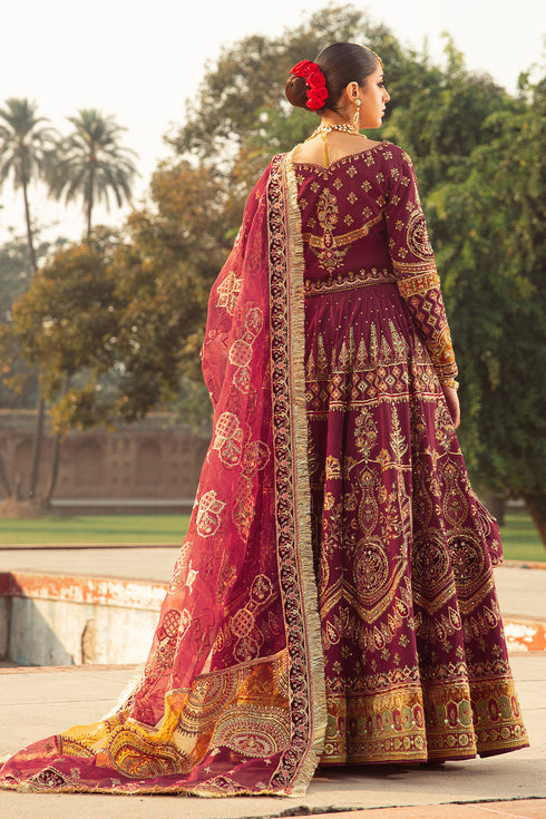 Side shot of Ismat showcasing full-sleeve raw-silk choli with adda detailing, lehenga embroidery panels, and draped organza dupatta.
