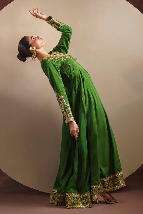 Side movement shot of KEZIA full length frock displaying wide flare and flowing raw silk panels