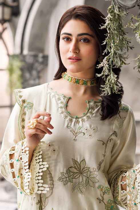 Close portrait showing embroidered round neckline and sequin detailing