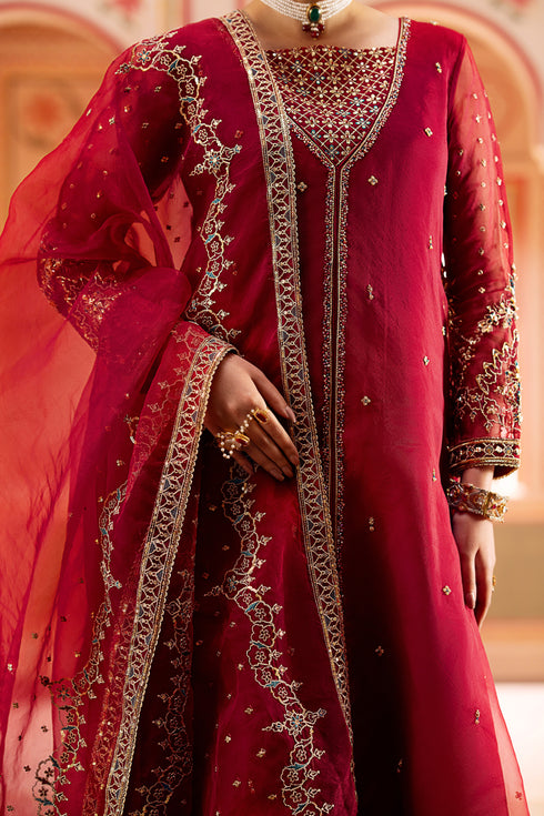 Detailed close-up of neckline embroidery and shimmering sequin craftsmanship.