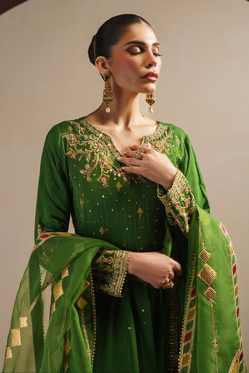 Three quarter pose of KEZIA angrakha dress showing tassel tie detail and fitted sleeve embroidery