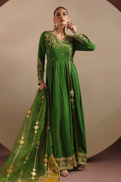Full standing view of KEZIA mehndi green wedding wear frock showing 90 inch flare and raw silk fall