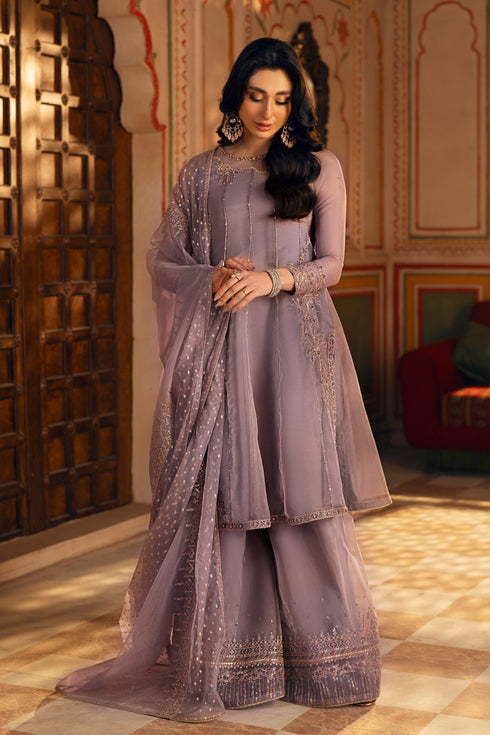 Full-length raw-silk culottes — with embroidered and sequin-trimmed hem for the complete look.