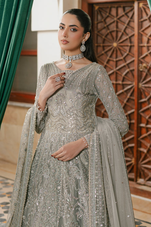Close-up of NAQSHI Arminha frock bodice showcasing dense hand embellishments—stonework, pearl clusters, crystal sitara, thread embroidery and self-textured net patterns.