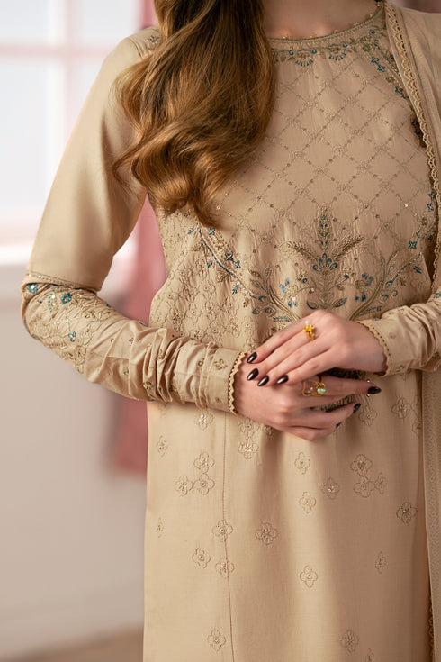 Close-up of NAQSHI Chamkeeli neckline embroidery featuring dense threadwork around round neck, paired with sequin detailing on beige cambric fabric