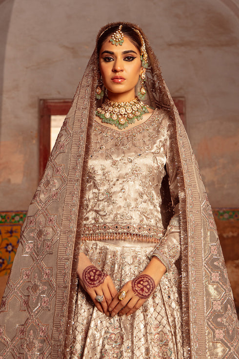Close‑up shot featuring full sleeve embroidery and mirror hangings cascading along Raniya choli sleeve edge.