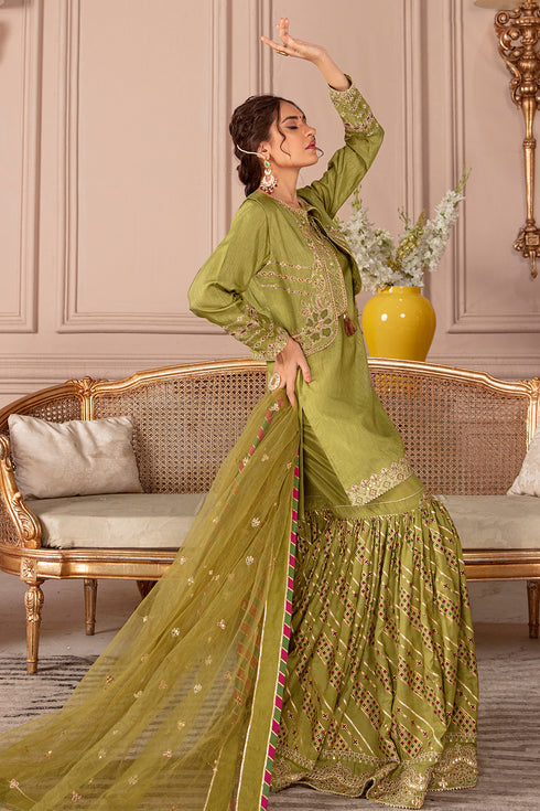 Side styling view of Eva mehndi green ensemble highlighting flowing dupatta and balanced silhouette, traditional ready to wear gathering attire.