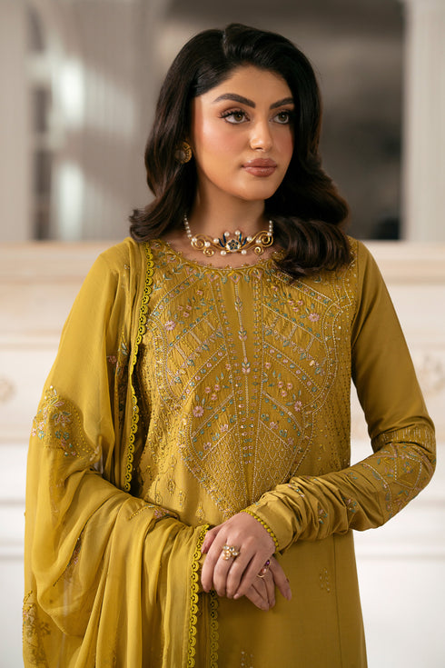 NAQSHI Nageena mustard cambric shirt featuring heavy embroidered round neckline with floral motif, lace-finish hem, straight pants visible