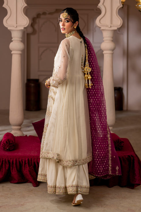 Side view of NAQSHI Abeeha layered frock showing detailed sleeve work, soft organza fabric, and graceful fall