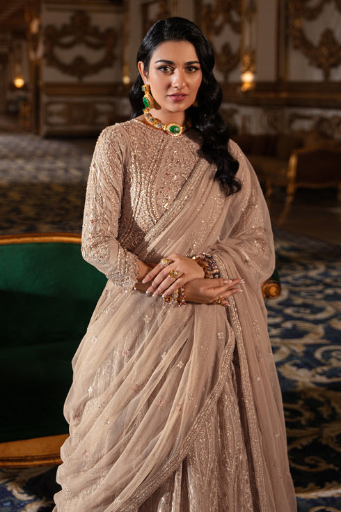 Macro shot focusing on Areeza’s scalloped sleeve edge with delicate lace, sequin hangings and hand-embroidered net finish.