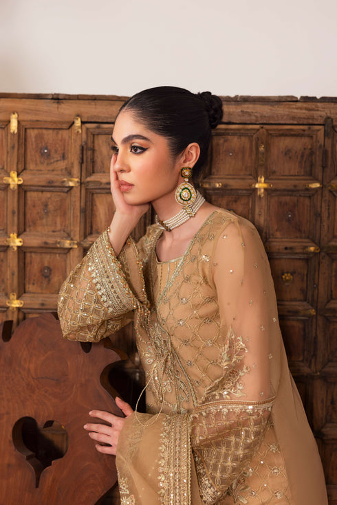 Detail of NAQSHI Marjaan front showcasing statement handmade tassel accented with crystal hangings at angrakha overlap.