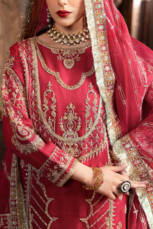 Model wearing full naqshi nehal bridal set: richly embroidered short shirt, statement back tassels, gypsy sharara & ornate dupatta styled for wedding elegance.
