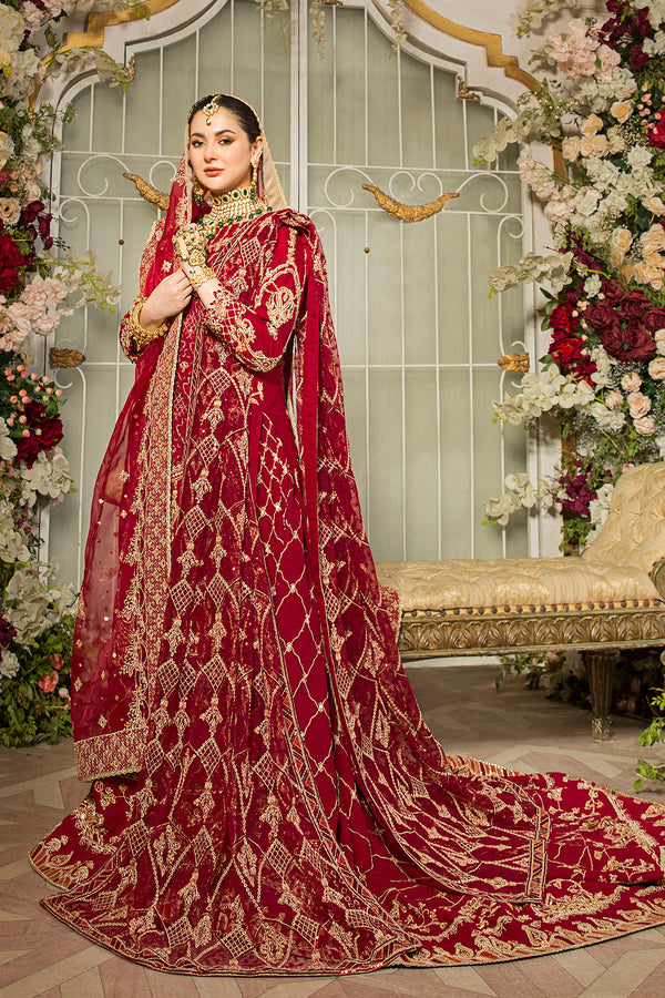 Naqshi Gehna deep-red raw-silk long shirt with multi-head embroidery, hand-adda, sitari, dabka work and tasselled tail lehenga, paired with embroidered pouch and matching dupatta.