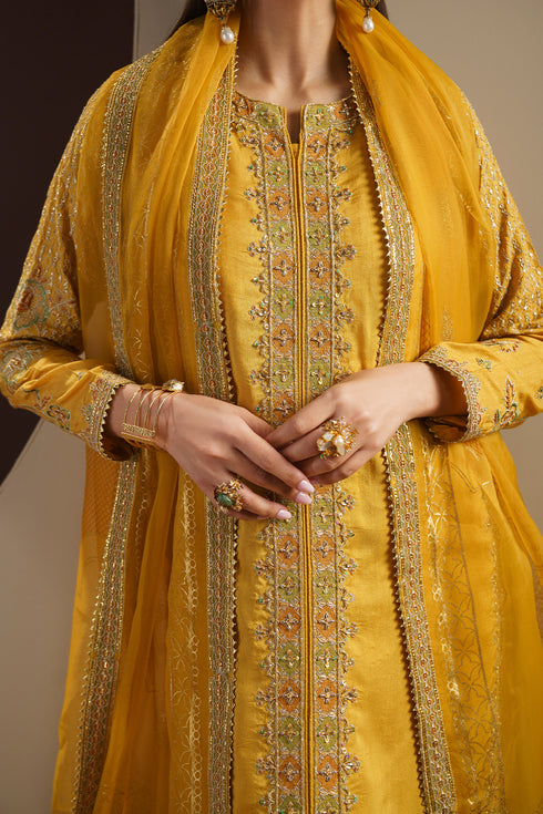 Close up detail of MAYA shirt front showing heavy embroidery, sequins and raw silk texture