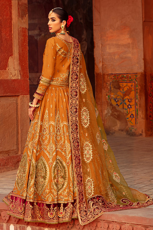 Side shot of Zarwisha choli showcasing boat neckline and full sleeves, plus lehenga flare with intricate dori work and velvet‑border detail.