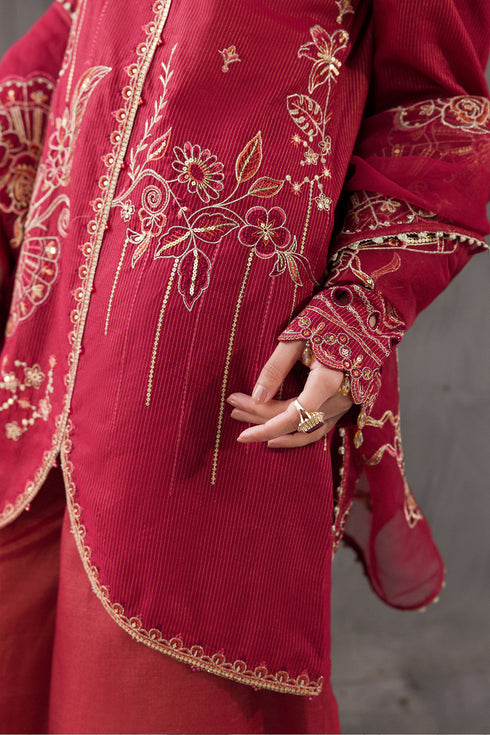 Close up of Gajra sleeve embroidery, lace edging and tassel detail on cotton massuri shirt