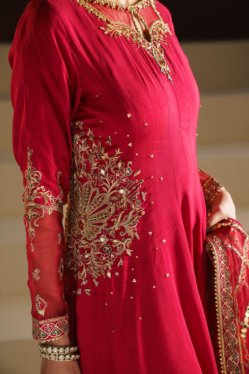 Close up of NAQSHI VANI red frock showing adda work embroidery and organza applique on bodice