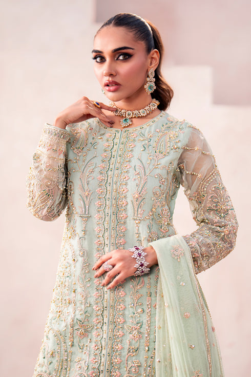 Close‑up of Naqshi Parsa sharara hem with sequin and embroidery border matching shirt embroidery accents.