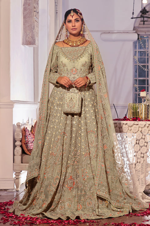 Naqshi Navreet beige net choli with square neckline decorated in crystal slings and heavy naqshi-dabka embroidery, paired with sequin jaal lehenga, matching dupatta, and structured pouch.