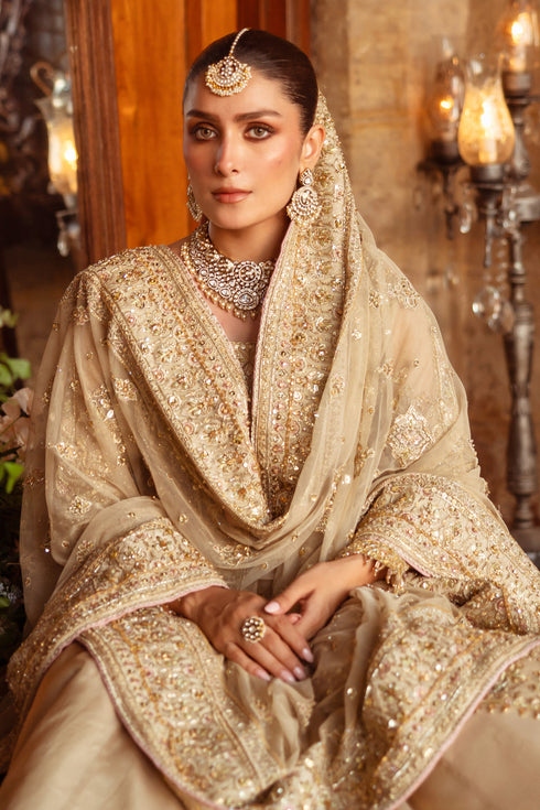 Macro shot of NAQSHI Roshan Ara gown bodice and sleeve highlighting dense naqshi work, dabka, payal, sitara, cut-dana and crystal embellishments.