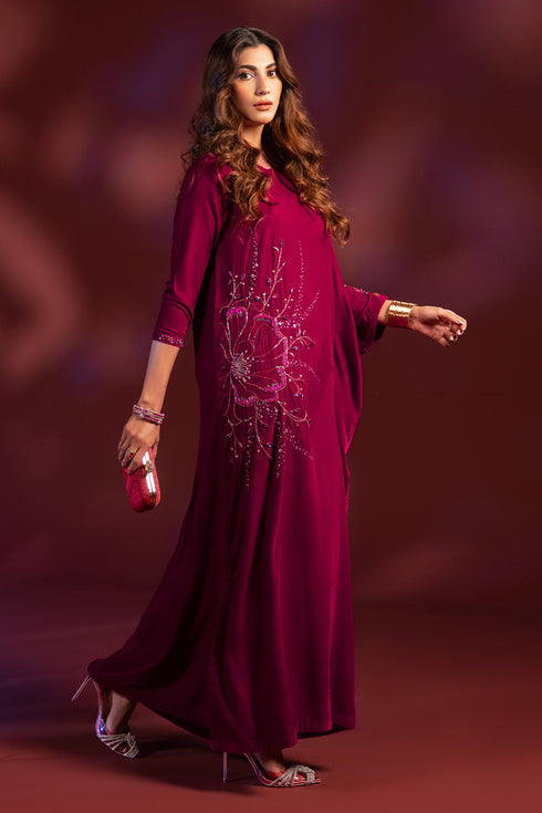 Full front standing view of NAQSHI Aelin velvet tunic showing kaftan cut, floral motif, and rich shocking pink color