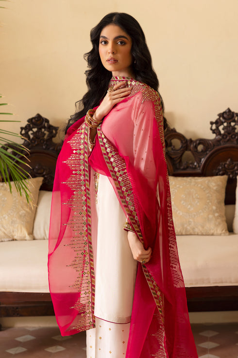 Close-up of NAQSHI Abish V‑neckline highlighting dense hand‑adda embroidery combining kora, dabka, sitari, cut dana, crystals, sheet & stone work against crisp white raw silk.