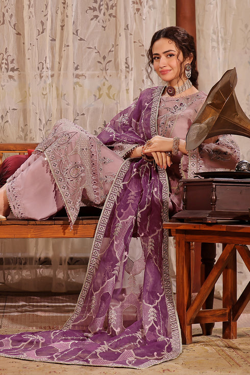 NAQSHI Abeer outfit in seated pose highlighting embroidered shirt, culottes, and soft organza dupatta styling
