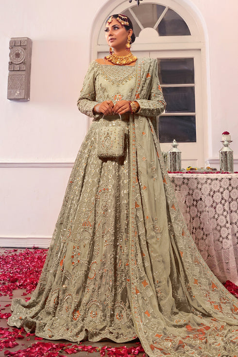 Side view of Naqshi Navreet highlighting choli’s flared cutline, crystal sling on neckline, delicate sequin flowers, and flary lehenga silhouette.