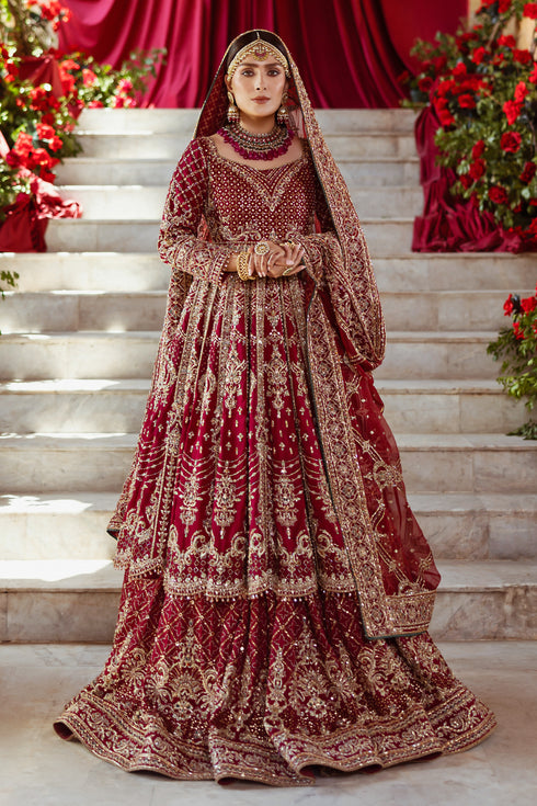 NAQSHI Jhankar garnet-red pure raw-silk kalidar frock with square neckline, fitted sleeves, dense hand-adda embroidery (naqshi, dabka, payal, cut dana, stone, crystal) across bodice, paired with Indian raw-silk lehenga and embellished dupatta.