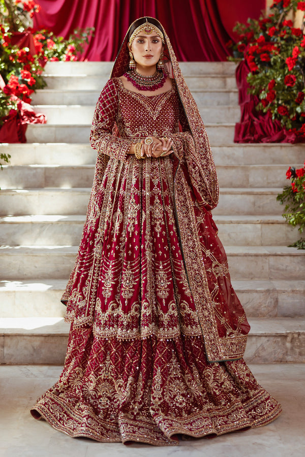 NAQSHI Jhankar garnet-red pure raw-silk kalidar frock with square neckline, fitted sleeves, dense hand-adda embroidery (naqshi, dabka, payal, cut dana, stone, crystal) across bodice, paired with Indian raw-silk lehenga and embellished dupatta.