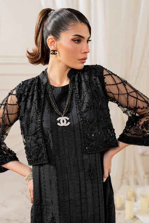 Front view of naqshi siara straight raw‑silk pants in black, showcasing clean lines and pairing elegantly with embroidered shirt.