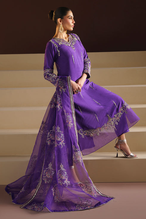 Macro of Wafiya neckline highlighting dense adda‑hand embroidery, sequins and crystal accents for festive shine.