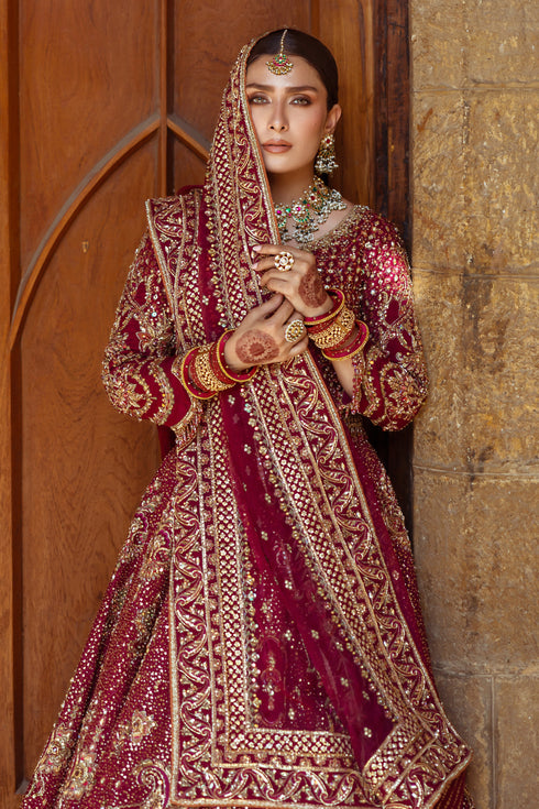 NAQSHI Kandhari net dupatta draped elegantly with hand‑adda motif spread, heavy embellished border and screen‑printed facing reflecting opulent style.