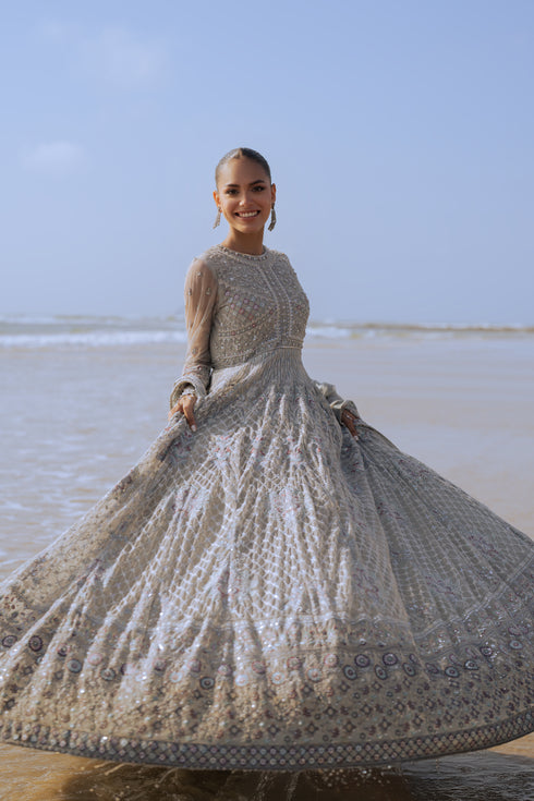 Rear view of NAQSHI Valeria frock showing hand‑embroidered mini motif spray across the back pantaloons, heavy embroidery continuing from bodice, and clean back sequin border.