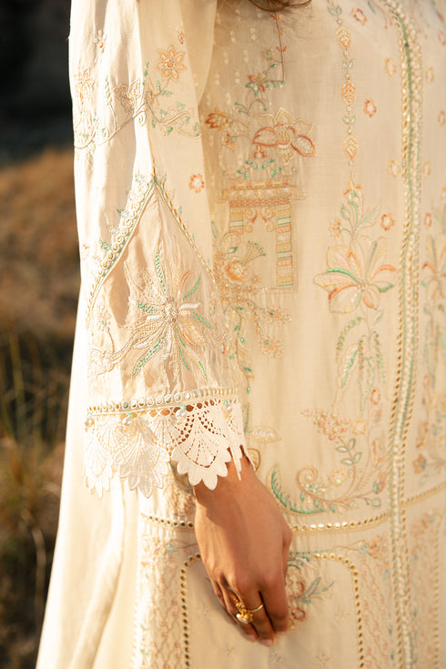 Detailed close up of hem embroidery lace trim and fabric texture on Meehru off white lawn shirt