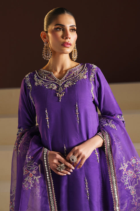 Model wearing full Naqshi Wafiya 3PC set: embroidered mustard organza shirt, pleated culottes & ornate dupatta styled for festive gatherings.