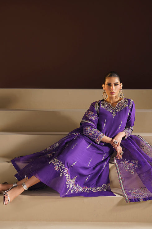 Detailed view of mustard organza culottes pleat with subtle embroidery along flows.