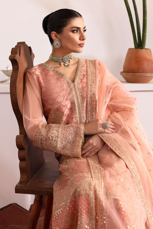 Close‑up of NAQSHI Muzna front panel detailing intricate Islamic‑Mughal embroidery, sequin work, contrasting floral motifs and border trims on organza.