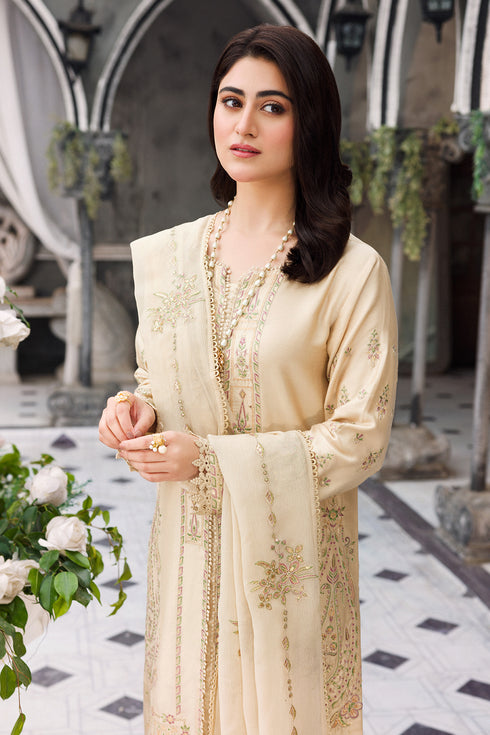 Mid view showing lace hem and tassel finish on embroidered shirt border