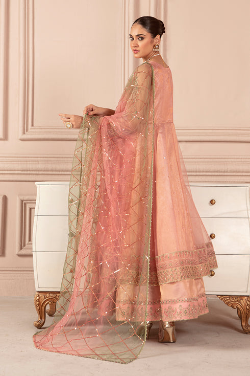 Side view of NAQSHI Amella blush pink layered frock showing embroidered sleeves and net dupatta fall