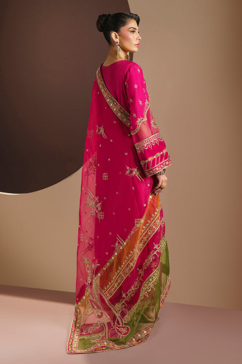 Side profile of ZUHI outfit highlighting straight shirt fall and embroidered PK raw silk culotte pants