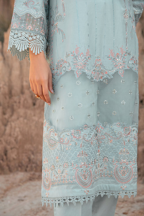 Detailed close up of hem embroidery and lace finishing on Zenaria aqua ready to wear lawn outfit