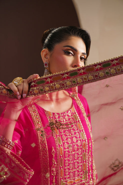 Close up of ZUHI neckline detailing with sequins, motif embroidery and raw silk base filling