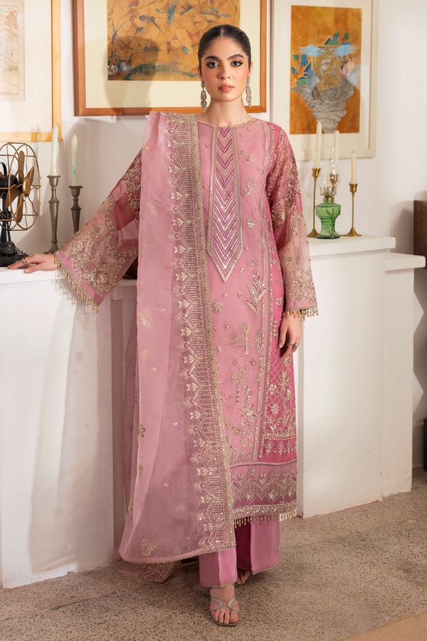 NAQSHI Nayab pastel-pink organza straight-paneled long shirt featuring near-neck geometric embroidery, heavy sequin texture, berry-pink patch panels on sides and sleeves.
