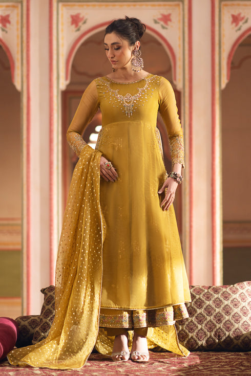 Front view of NAQSHI Mehrosh mustard organza frock with round neck, detailed embroidery, sequins & hanging tassels at side slits