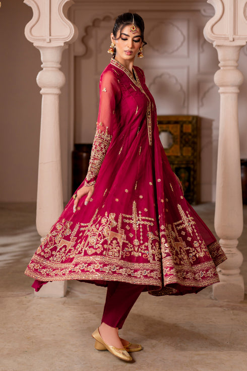 Macro of Zaafia frock panel displaying pure adda line motifs with floral sequin work and contrasting orange‑zinc hues on organza.
