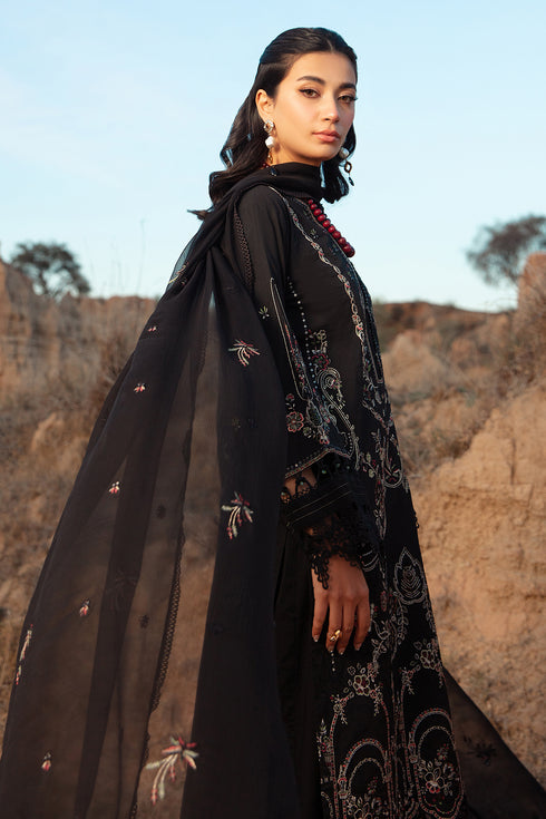 Side profile of black embroidered outfit with flowing crinkle dupatta and lace border ready to wear evening wear dress