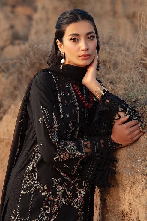 Portrait view highlighting round neckline handmade buttons and embroidery on Surmaya black lawn shirt