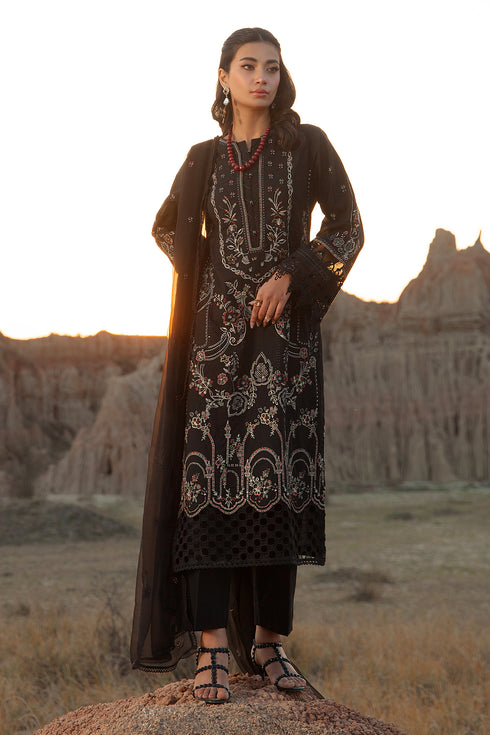 Front standing view showing heavy self jaal embroidery and tilla work on black long shirt semi formal women dress